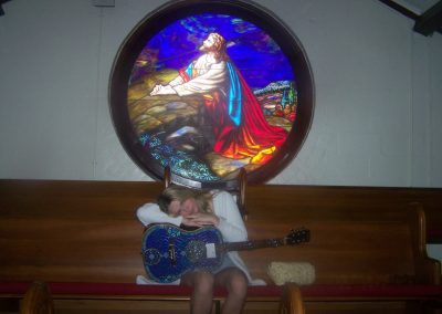 Jada Wilson with Guitar and Stained Glass